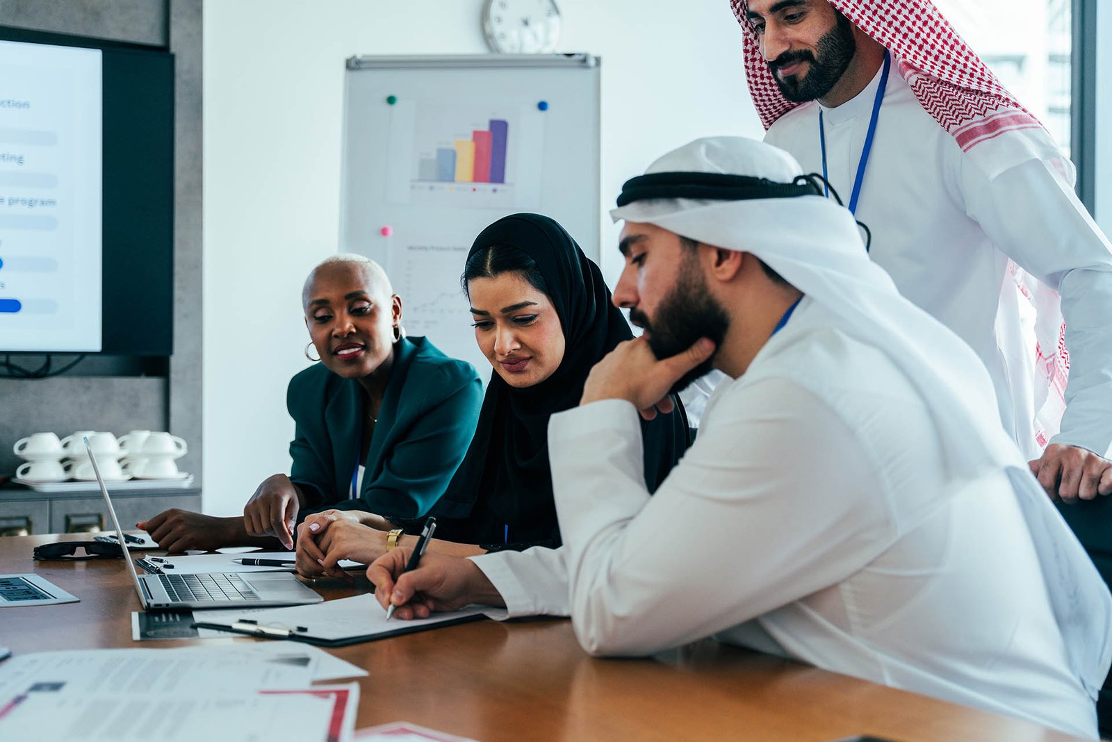 Multiethnic business team collaborating during corporate meeting in dubai office